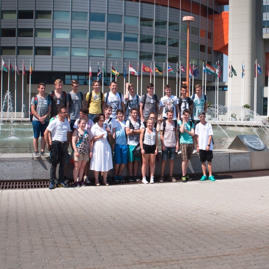 School class posing for a group photo on the Memorial Plaza at the UN in Vienna