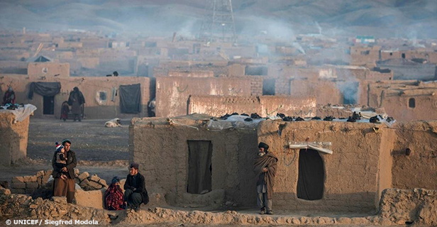 © UNICEF/ Siegfred Modola | Smoke rises from the chimneys of houses in a camp for displaced people during a harsh winter in Afghanistan.