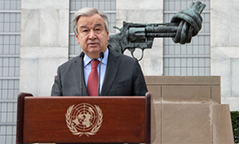 Secretary-General António Guterres briefs reporters on the situation in Ukraine in front of the Knotted Gun sculpture at UN Headquarters. UN Photo/Eskinder Debebe