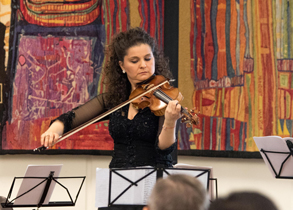 Hungarian violinist, Orsolya Korcsolan, performing in the VIC during commemorative ceremony on Holocaust Remembrance Day